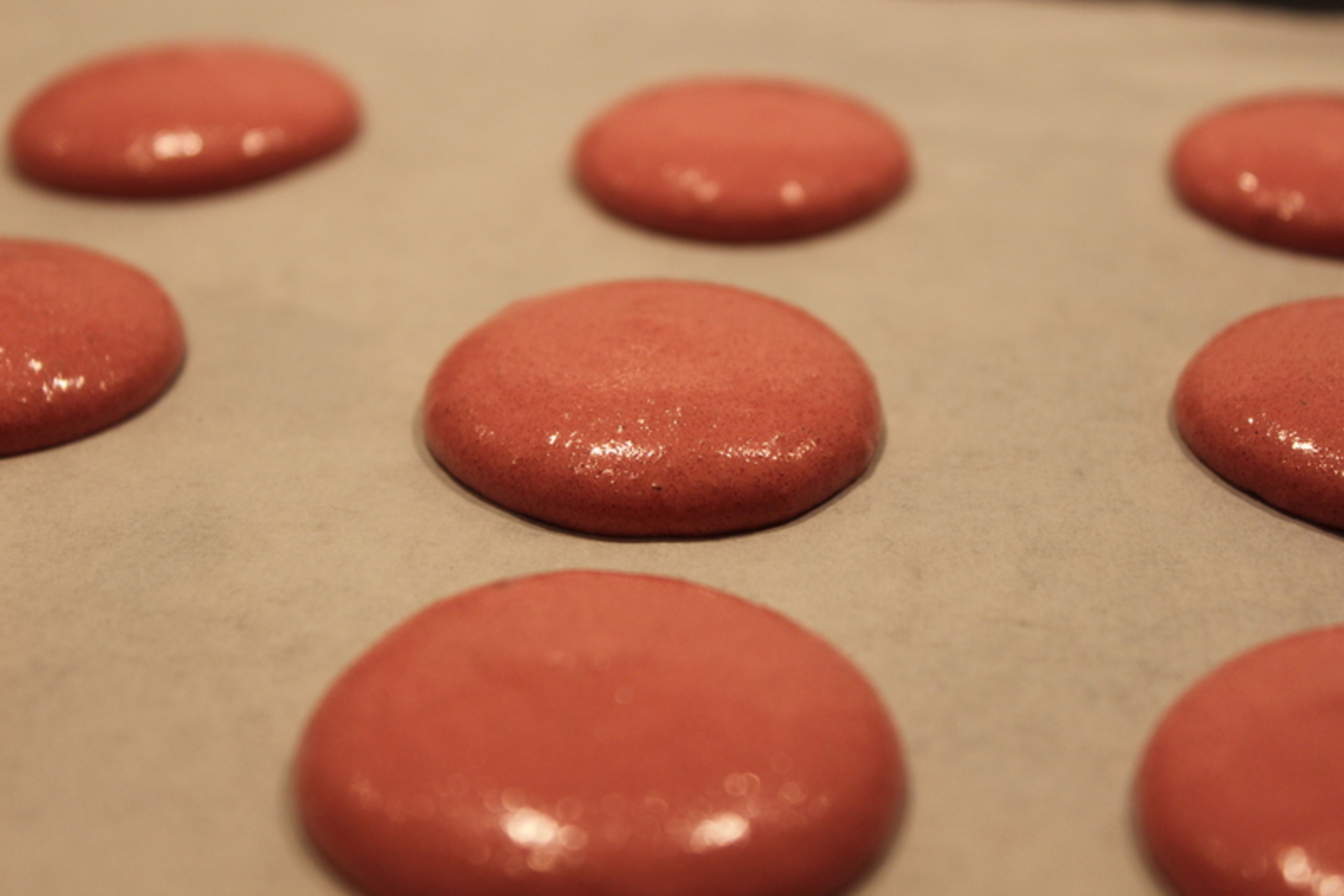 Unbaked red macarons